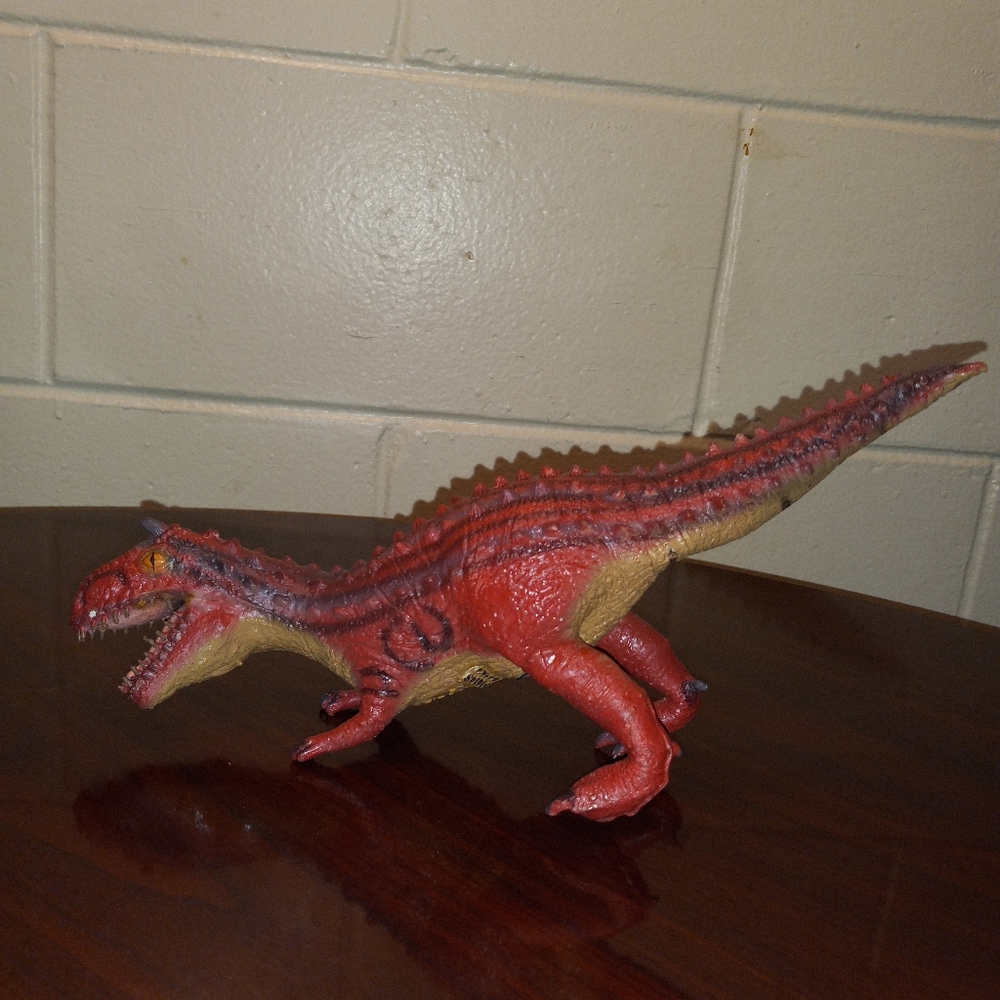 2 Disney Dinoland Animal Kingdom Rubber Latex Carnotaurus and T-Rex Dinosaurs